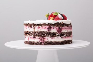 close up of conceptual fruit cake on gray background