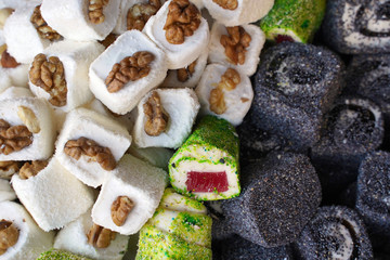 Assortment of fruit jellies with nuts and poppy seeds for food texture