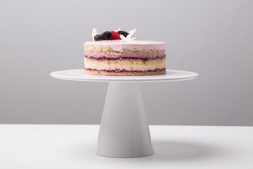 close up of conceptual fruit cake on gray background