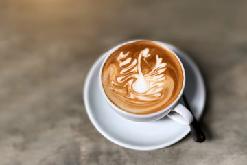 Latte Art Coffee placed on a wooden table
