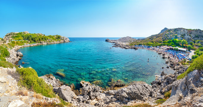 Ladiko bay with Ladiko beach with sun beds and sun shades (Rhodes, Greece)