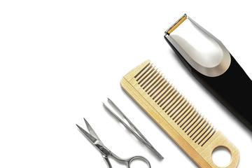beard trimmer and hairdressing tools on a white background