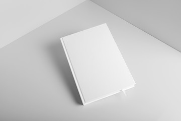 Real photo, blank book, brochure, booklet mockup template, hard cover, isolated on light grey background to place your design. 