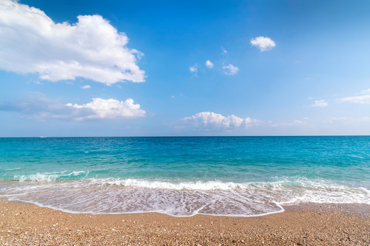 View of sea from Afandou beach near Faliraki, bluy sky, clouds, (Rhodes, Greece)