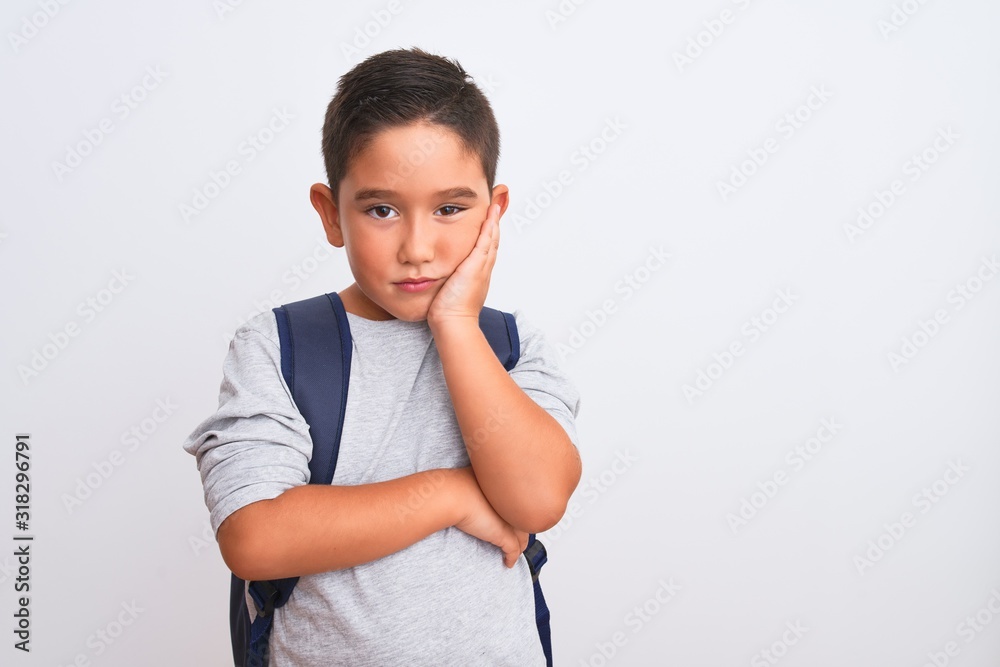 Poster beautiful student kid boy wearing backpack standing over isolated white background thinking looking 