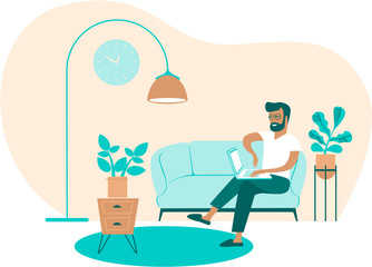 Young man using laptop at home working as freelancer