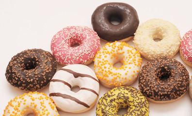 Delicious donuts on light background.