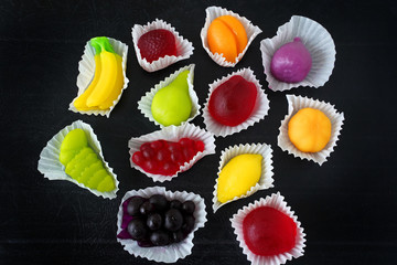 fruit jelly candies on black background