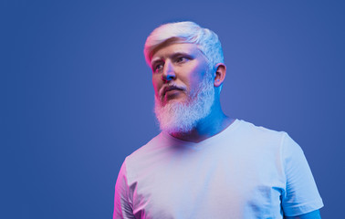 Confident adult man with albinism looking away