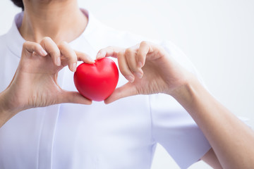 Nurse showing heart model for healthy concept with heart