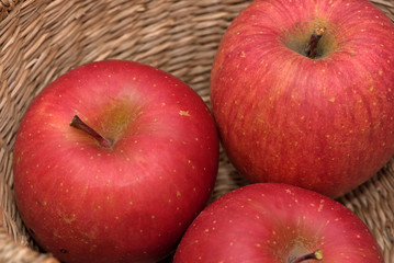 Red apple in a basket, Closeup