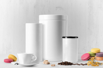 Coffee can, jar composition mockup on white wooden background, with cookies, coffee and blank label to place your design
