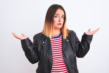 Young beautiful woman wearing striped shirt and jacket over isolated white background clueless and...