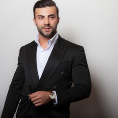 Handsome young elegant man studio portrait.