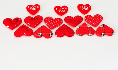 Hearts on a white background. Valentine's Day top view Copy the area on the flat greeting card.
