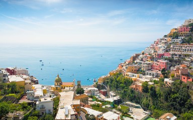 Beautiful Positano on hills leading down to coast and azure sea, Italy