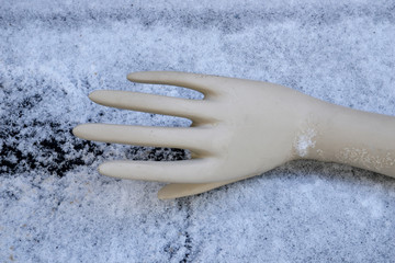 a mannequin hand in the snow