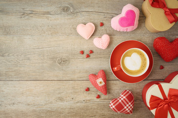 Valentines day background with heart shapes, coffee cup and  gift boxes.