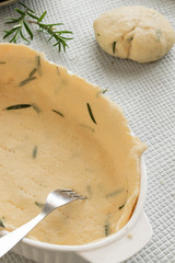 Cooking dough with fresh rosemary, homemade bakery themes, culinary and food concept