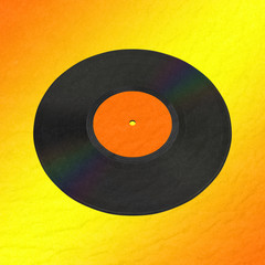 An old music disc on orange background