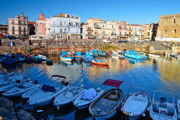 Pozzuoli, Italy. View of boats in the ancient port - obrazy, fototapety, plakaty