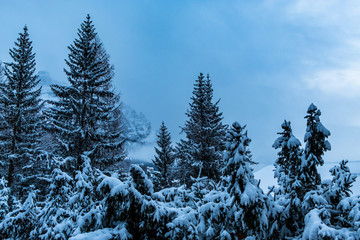 Stormy clouds in italian dolomites in a snowy winter