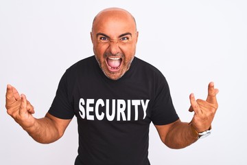 Middle age safeguard man wearing security uniform standing over isolated white background shouting...