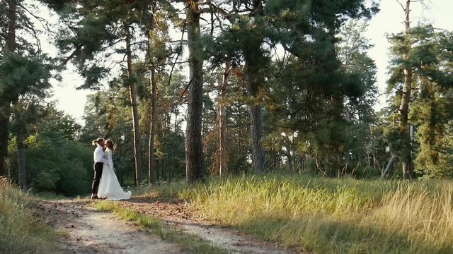 A young girl approaches a guy and throws the dress back