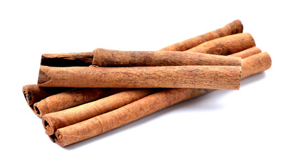 Cinnamon sticks seasoning isolated on white background. Close-up.