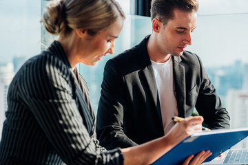 Corporate business team meeting discussion and startup concept. Successful businesspeople discussing together in conference room during meeting at modern business lounge high up in an office tower.
