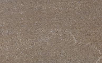 Fototapeta na wymiar Oberfläche einer braunen Sandstein-Platte mit feiner Kante