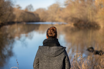 The Glance to the distance, Woman from behind at a river