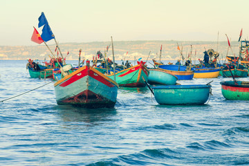 Fototapeta premium Traditinal Basket Boats on blue sea in Phan Thiet, Mui ne, Vietnam