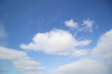 background of white fluffy cumulus clouds