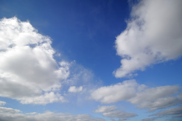 Fototapeta na wymiar background of white fluffy cumulus clouds