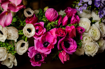 Beautiful bouquet of crimson poppy with green leaves