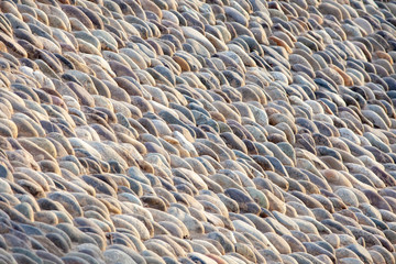 Wall of sea stones, background. Neatly laid out fence. Background, copy paste.