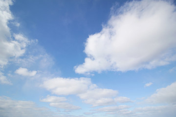 background of white fluffy cumulus clouds