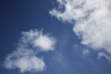 background of white fluffy cumulus clouds