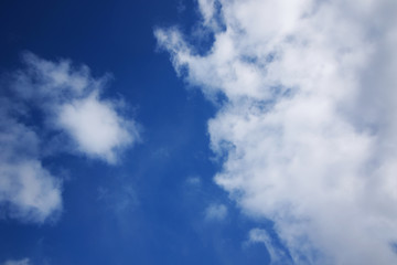 background of white fluffy cumulus clouds