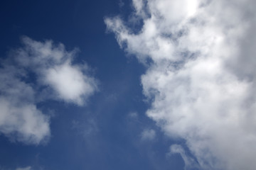 background of white fluffy cumulus clouds
