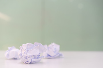 close up crumpled paper ball on the table after rejection project for working concept