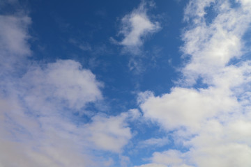 Blue sky with white cumulus clouds