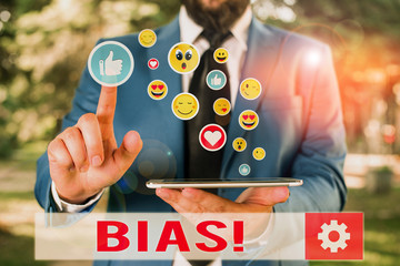 Conceptual hand writing showing Bias. Concept meaning inclination or prejudice for or against one...