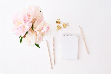 Mockup white notebook with pink peonies on a white background