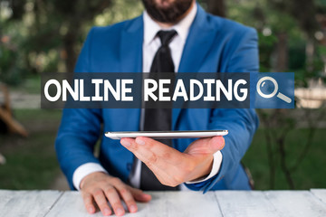 Text sign showing Online Reading. Business photo showcasing process of extracting meaning is in a...