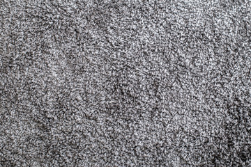 texture of a dark gray soft carpet with a fleecy basis, straight