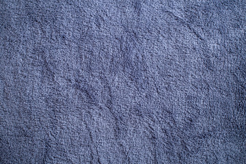 a texture of a dark blue soft plaid with a fleecy base, straight