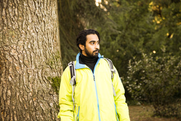 young man hiking in a forest