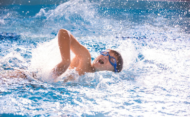 boy swimming  in pool